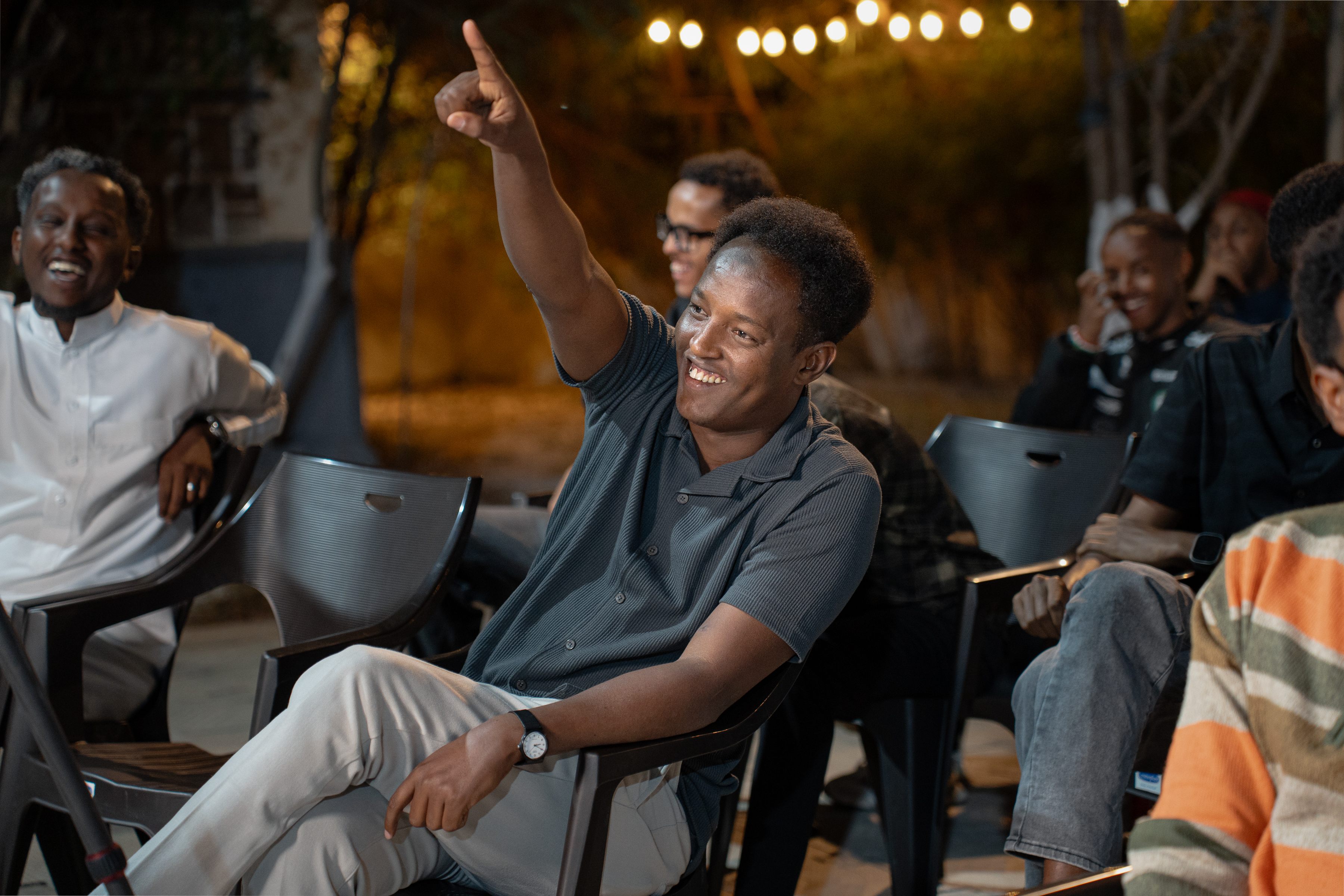 An audience member engaging enthusiastically with the discussion