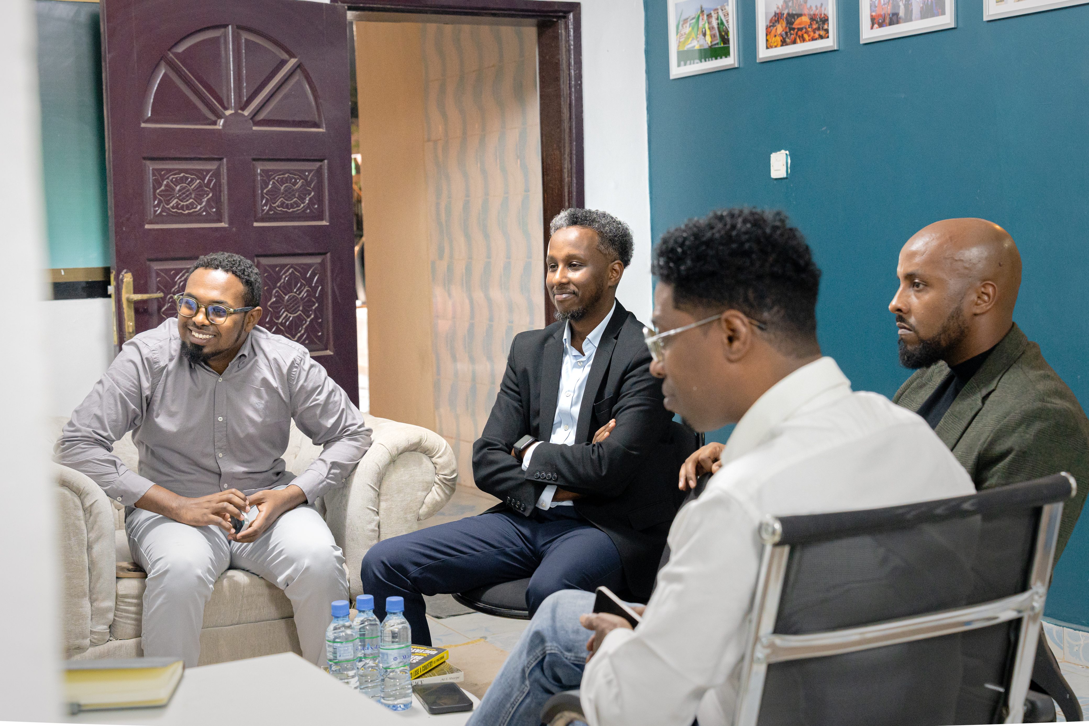 Guests in conversation before a public forum