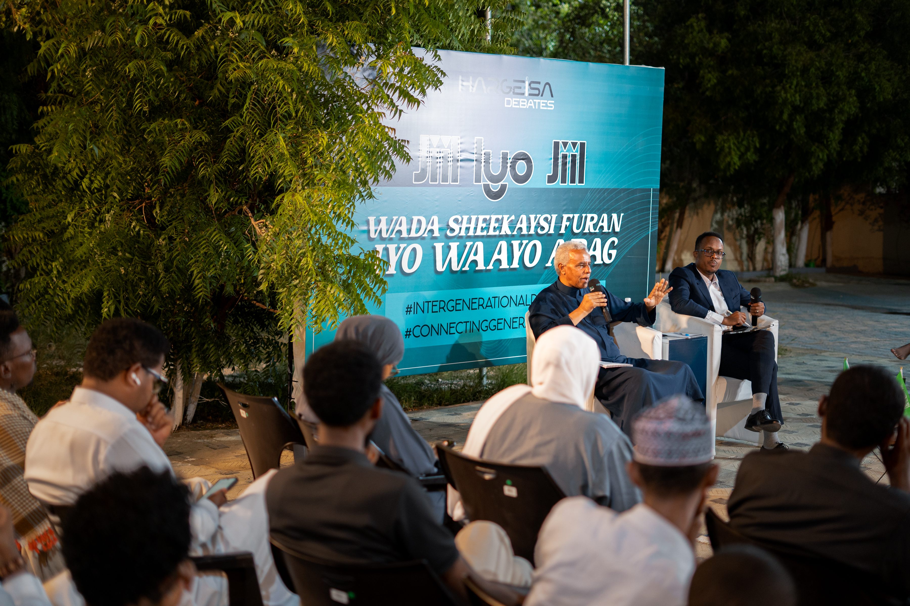 Speakers leading an intergenerational public dialogue