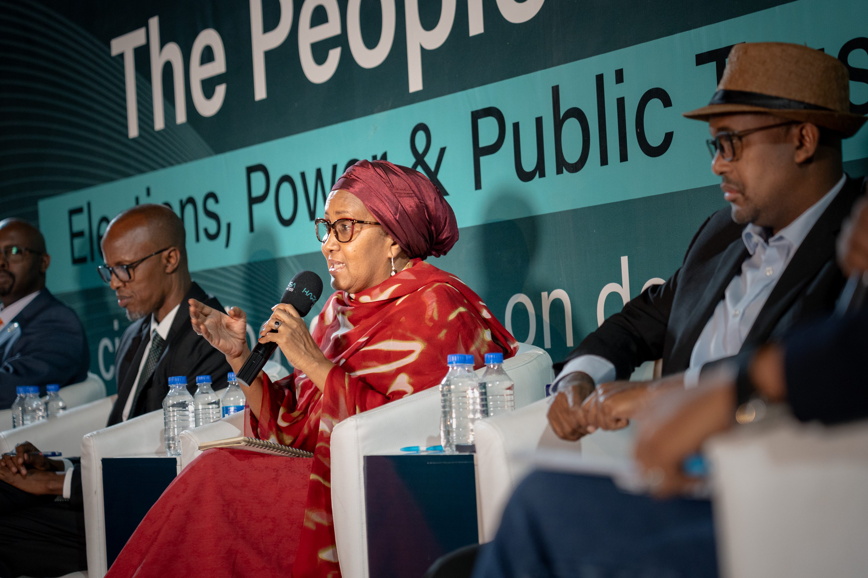 A woman panelist discussing elections and public trust