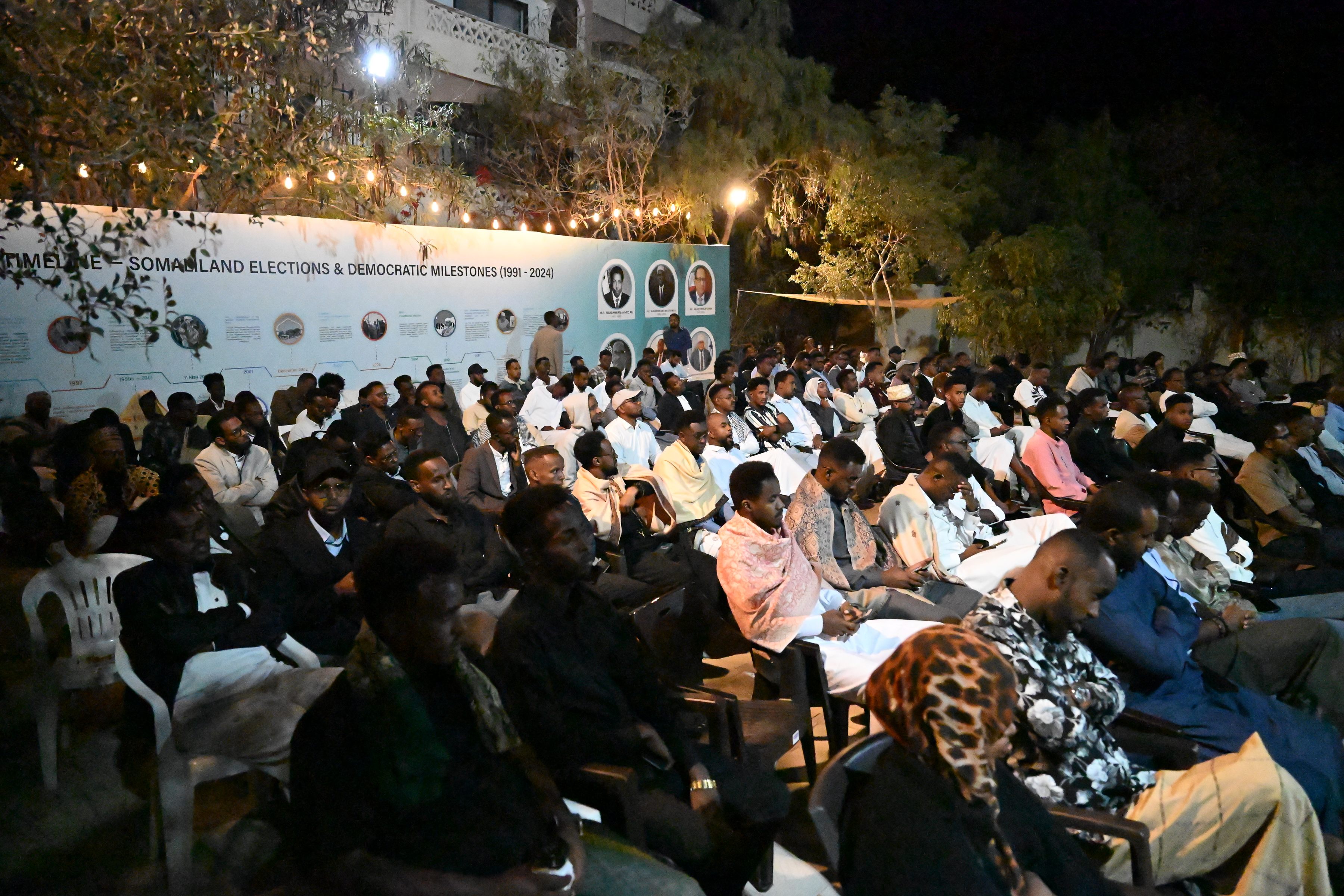 Large community audience at an evening Hargeisa Debates event